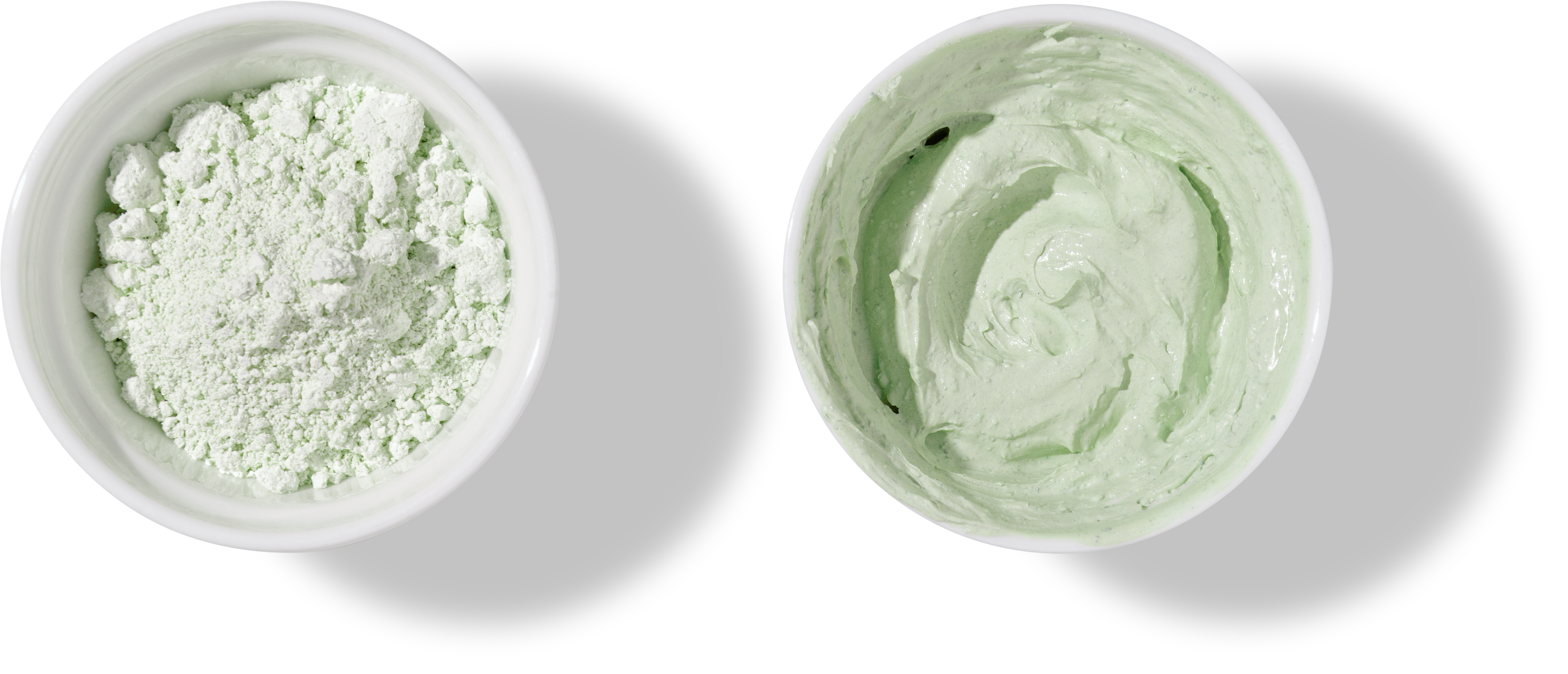 White bowls with green cosmetic clay on transparent background - mineral powder, bentonite facial mask. Skincare beauty concept.